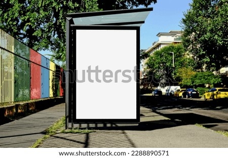 bus shelter at bus stop. blank lightbox billboard ad sign. white ad poster and commercial space. green urban street. display panel. empty vertical outdoor poster space. mockup base  background 