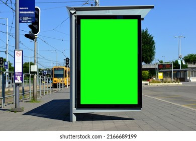 Bus Shelter And Bus Stop In Urban Bus And Tram Terminal Area. Light Traffic. Glass And Aluminum Structure. Poster Ad Display Glass And Light Box. Banner And Copy Space. Streetscape. Mockup Base