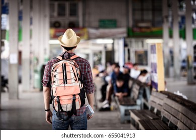 Bus station with young man are enjoying traveling.