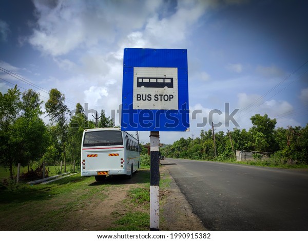 Bus stop board\
on road, blue bus stope board\
