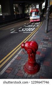 Bus Stop By A Fire Hydrant