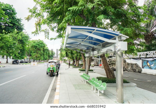 bus stop with Thailand motor-tricycle taken in\
Bangkok on 24 June 2017