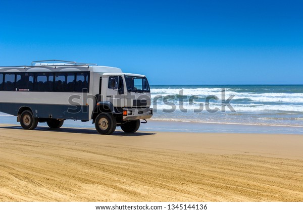 bus trip on beach road higway in fraser island,\
travel australia adventure