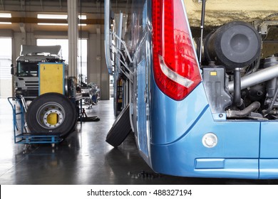 bus and truck waiting for service in the garage