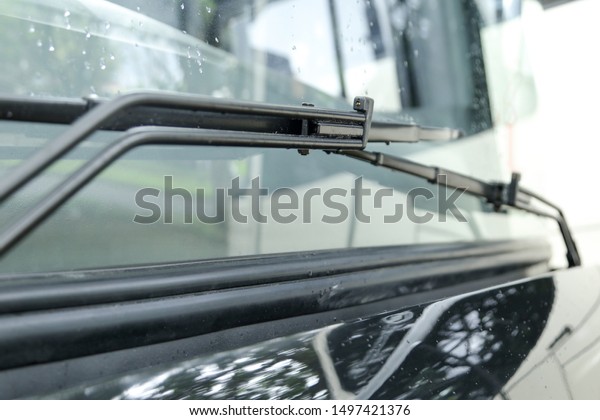 bus\
windscreen wiper blades on rain weather close\
up