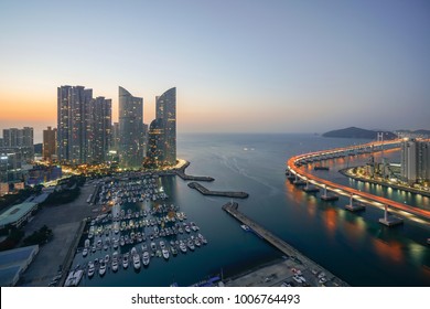 Busan City Skyline View At Haeundae District, Gwangalli Beach With Yacht Pier At Busan, South Korea. Ariel View.
