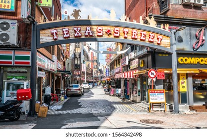 Busan Korea , 3 October 2019 : Texas Bars Street View With Entrance Sign In Busan South Korea