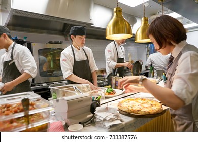 BUSAN, SOUTH KOREA - MAY 28, 2017: Staff In Modern Open Kitchen Of The Place Italian Bistro At Lotte Department Store