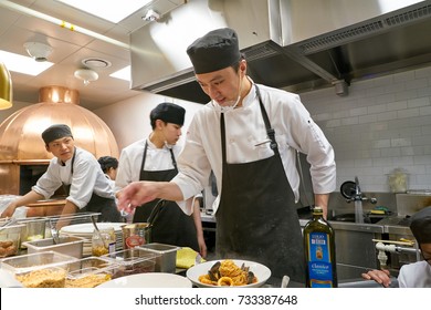 BUSAN, SOUTH KOREA - MAY 28, 2017: Staff In Modern Open Kitchen Of The Place Italian Bistro At Lotte Department Store