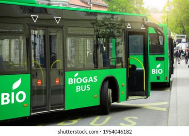 Buses Powered By Biogas On A City Street. Carbon Neutral Transportation Concept