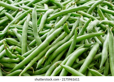 Bush beans are green beans that grow on a short, bushy plant. Common bush bean varieties include Blue Lake Bush, Roma II (Romano), Masai (Filet), and heirloom Kentucky Wonder Bush. High quality pic.