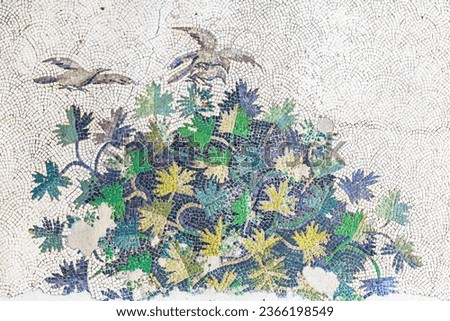 Bush and birds. Ancient Byzantine mosaic. Close up fragment