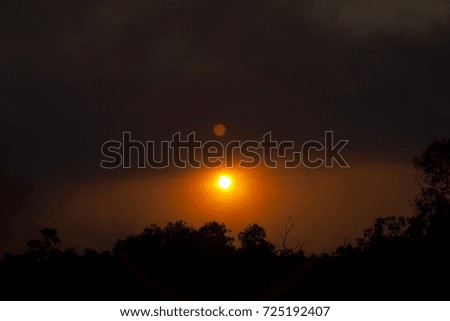 Similar – Image, Stock Photo Blood moon at total lunar eclipse, shining through trees