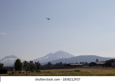 Bush Plane Flying In Front Of A Mountain Before Landing