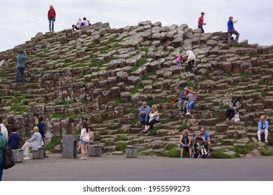 Bushmills, Northern Ireland - July 21 2014: People On Top Of The Basalt Columns Of The Giant's Causeway