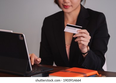 Busiesswoman Holding Creditcard And Using Laptop Computer For Online Shopping, Online Payment, E-commerce, Internet Banking.