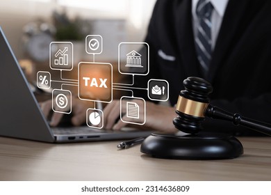 Busines using a computer to omplete income tax return form online. Calculation tax return concept.