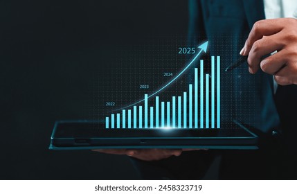 Business 2025 analytics tools charts and graphs with statistics to analyze business potential and forecast future development of companies growth. Businessman using a tablet. - Powered by Shutterstock