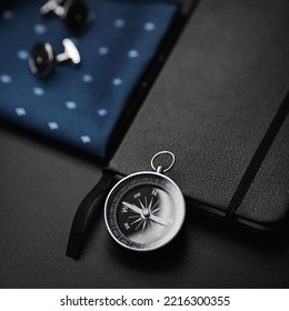 Business accessories. Antique compass on black background. - Shutterstock ID 2216300355