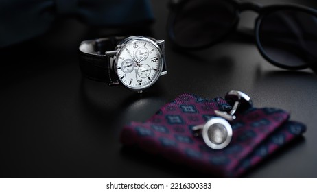 Business Accessories. Mens Watch And Cufflinks Isolated On Black Background.