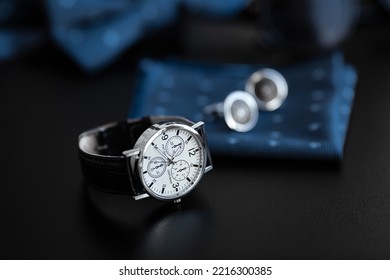 Business Accessories. Mens Watch And Cufflinks Isolated On Black Background.