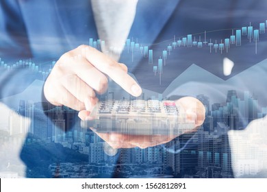 Business Accountant Woman Using Calculator For Calculating Financial Investment Tax Income And Profit Estimate, Double Exposure Of Businesswoman Hands Is Holding Calculator With Cityscape Background