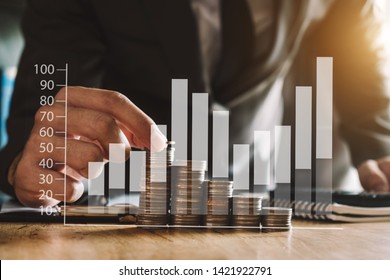 Business accountant working on desk using mobile phone and calculator to calculate budget concept finance and accounting in morning light
 - Shutterstock ID 1421922791