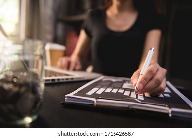 Business Accountant Working On Desk Using Mobile Phone And Calculator To Calculate Budget Concept Finance And Accounting In Morning Light