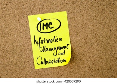 Business Acronym IMC Information Management and Collaboration written on yellow paper note pinned on cork board with white thumbtack, copy space available