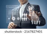 Business administrator in action of manpower or human resource planning or business organization on a virtual dashboard.