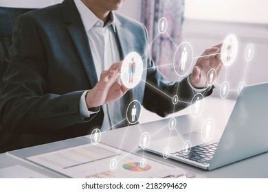 Business administrator in action of manpower or human resource planning or business organisation on a virtual dashboard.