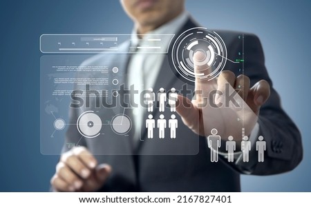 Business administrator in action of manpower or human resource planning or business organization on a virtual dashboard.
