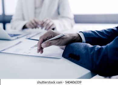 Business Adviser Analyzing Financial Figures Denoting The Progress In The Work Of The Company