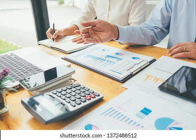 Business advisor analyzing financial figures denoting the progress Internal Revenue Service checking document. Audit concept - Powered by Shutterstock