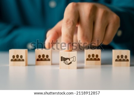Business Agreement Ideas, Wooden Cube Blocks Businessman icon shaking hands, business cooperation.