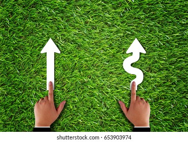 Business Alignment Concept, Strategy And Planning, Hand And Arrow On Green Grass Background