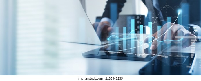 Business analysis. Businessman working on laptop computer analyzing finance sales data and economic growth graph chart and financial report, business and technology concept. - Shutterstock ID 2185348235