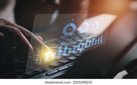 Business analysis. Businessman working on laptop computer analyzing finance sales data and economic growth graph chart and financial report, business and technology concept