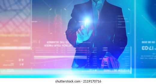 The business analyst manages business processes by touching a virtual screen with holographic charts and diagrams. Contemporary digital business technologies.