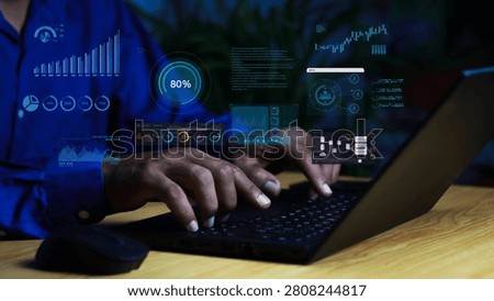 Business analyst using a laptop with virtual dashboard displaying data analytics, KPI metrics, business intelligence, financial reports, performance monitoring, digital transformation, and data visualization.