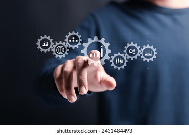 Business analytics and big data analysis concept. Process automation management with KPI financial charts and graph, marketing dashboard. Businessman touching analysis icon on virtual screen.