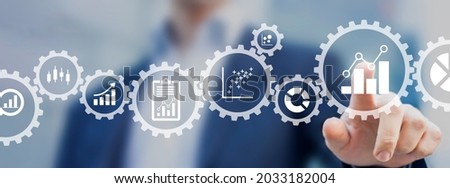 Business analytics consultant working with metrics and charts to build a key performance indicator dashboard for senior managers. Marketing or operations management. Data analyst creating report.