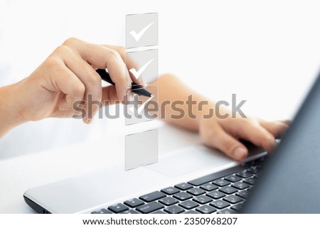 business approval project concept, businessman using pen to mark correct mark in check box for document quality control checklist