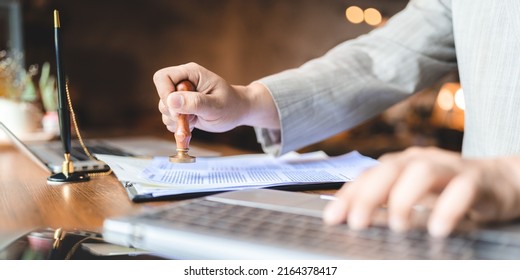 business approve and certificate concept, confirmation of business marketing document permit and certified stamping, signing on business partner paper to success, or concept of attorney and insurance - Shutterstock ID 2164378417