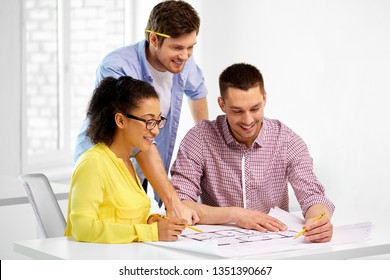 business, architecture and people concept - creative team of architects or interior designers with blueprint working at office - Shutterstock ID 1351390667