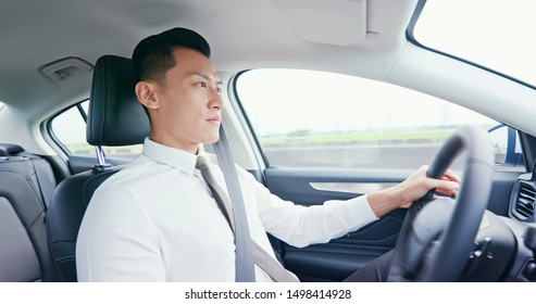 Business Asia Man Driving Happily In The Car On Highway