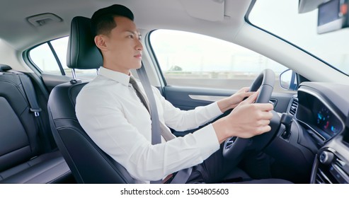 Business Asia Man Driving Happily In The Car On Highway