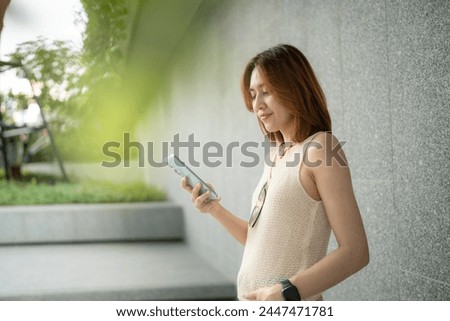 Business asian woman casual use smartphone city building communication happy enjoy business woman