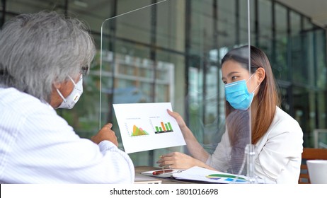 Business asian woman presenting to her boss and wear masks to protect and take care of their health - Shutterstock ID 1801016698