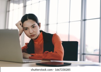 Business Asian Woman Stress And Depress From Corona Virus Covid Pandemic Outbreak News Topic. She Paranoid World Of Economy Finance And Marketing. Work Place With Computer